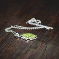 peridot necklace, meaning of the August birthstone and facts about Peridots