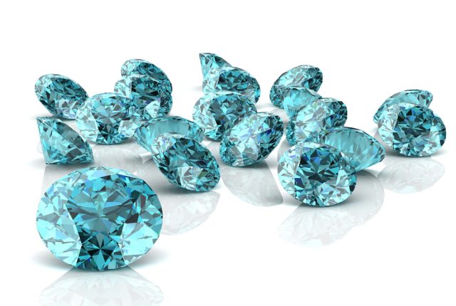 loose aquamarine crystals, March Birthstone Meaning And Fun Facts About Aquamarine Gemstones