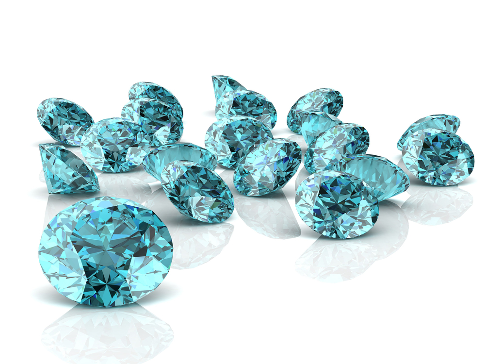 loose aquamarine crystals, March Birthstone Meaning And Fun Facts About Aquamarine Gemstones