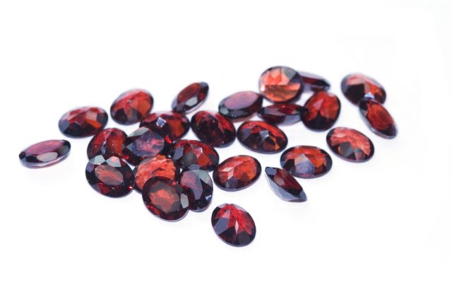 Loose garnet gems, January Birthstone Meaning And Fun Facts About Garnet Gemstones