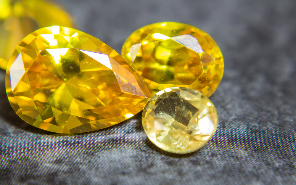 loose yellow and golden gemstones